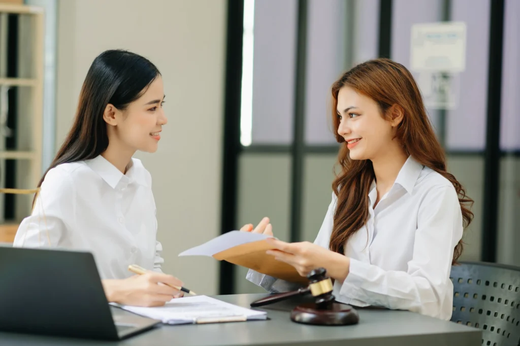 Immigration lawyer providing free consultation to a client in an office setting